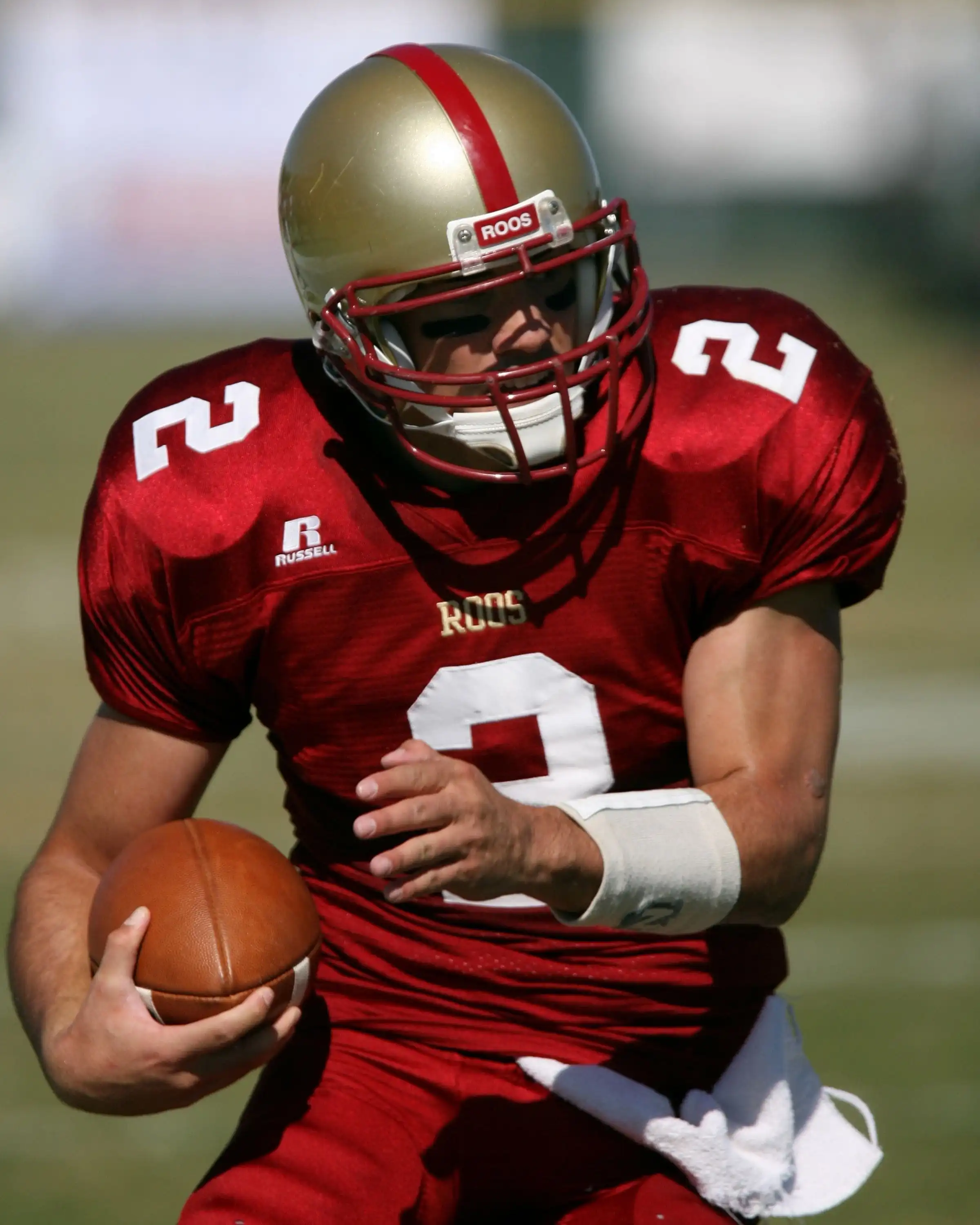 American football player running with the ball